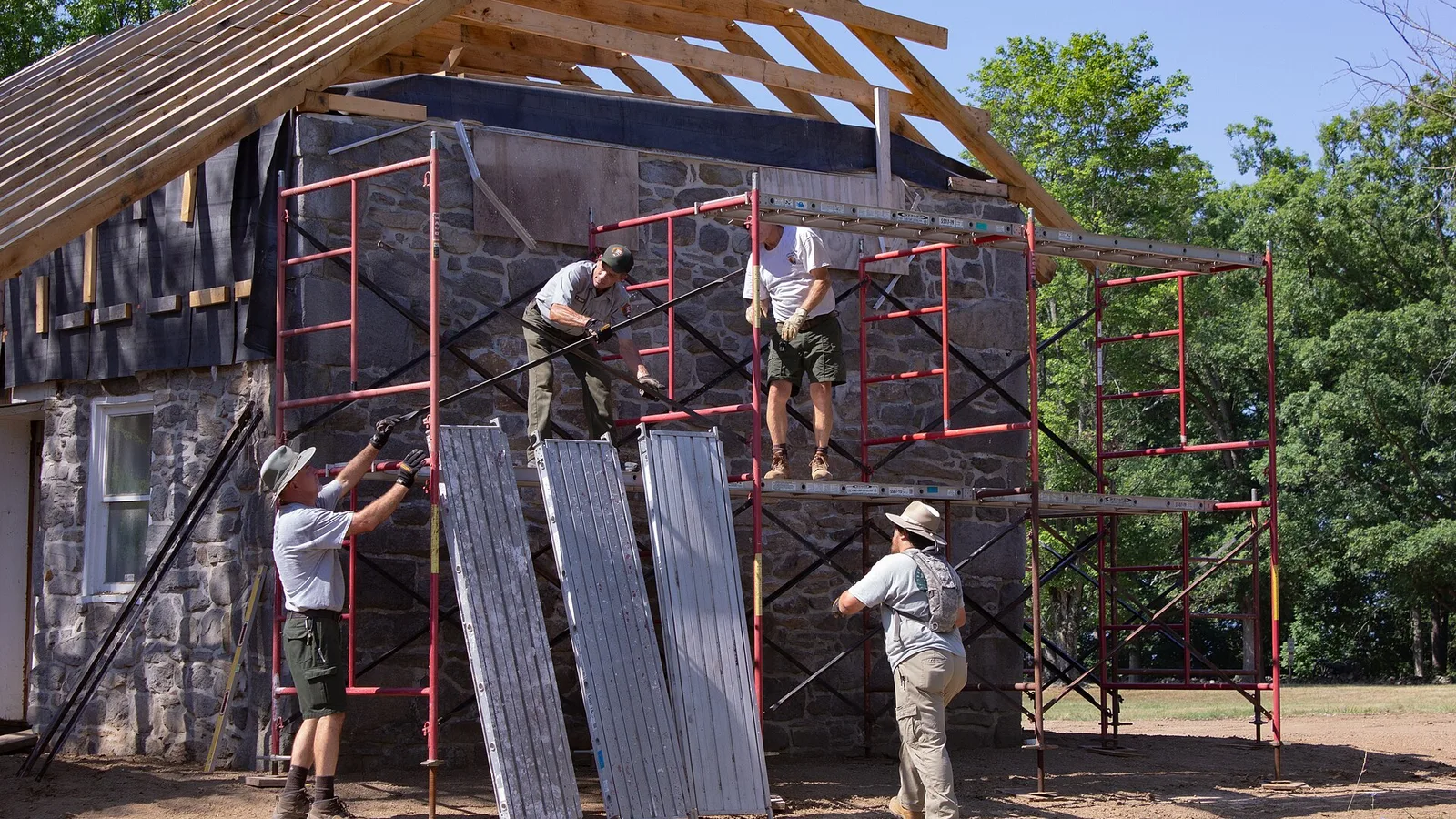 Preservationists erect scaffolding on the gable ends of the house to complete roofing and masonry work. (c1494935 810d 40ea b2cc d04cb9d066bd)