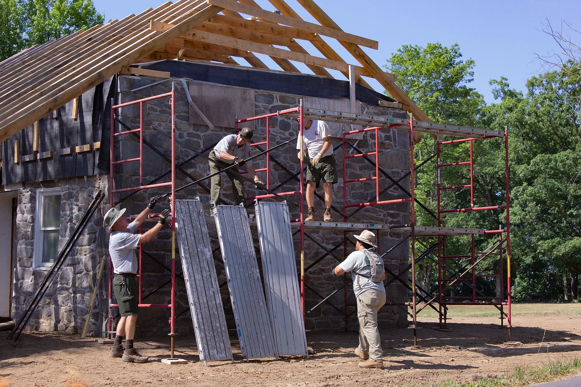 Preservationists erect scaffolding on the gable ends of the house to complete roofing and masonry work. (c1494935 810d 40ea b2cc d04cb9d066bd)