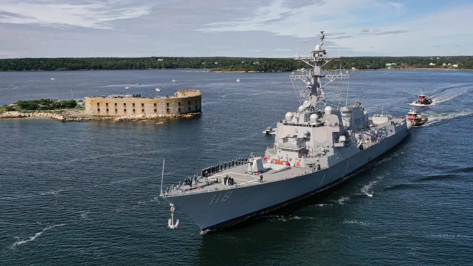 The future USS Daniel Inouye (DDG 118) departs General Dynamics Bath Iron Works shipyard.