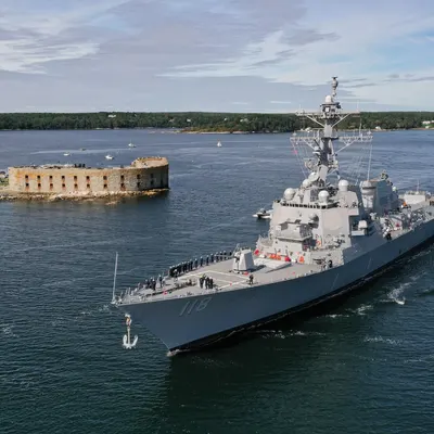 The future USS Daniel Inouye (DDG 118) departs General Dynamics Bath Iron Works shipyard.