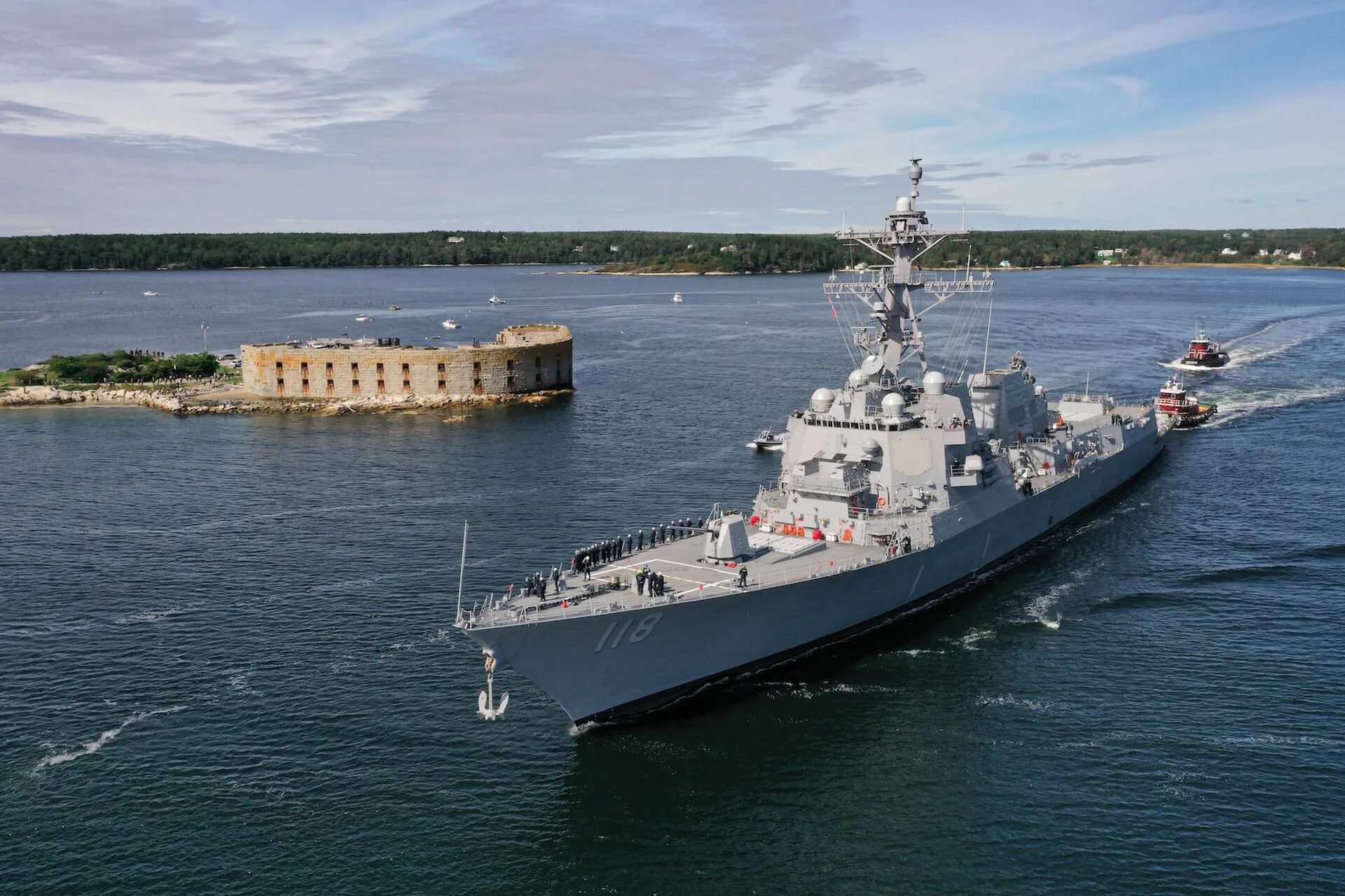 The future USS Daniel Inouye (DDG 118) departs General Dynamics Bath Iron Works shipyard.